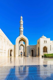 Arched gates and minaret of the Sultan Qaboos Mosque, Muscat, Arabian Peninsula, Sultanate of Oman