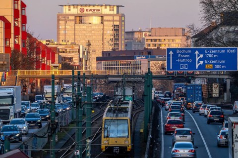 The A40 motorway, Ruhrschnellweg, in the city passage in Essen, light rail line U18, evening