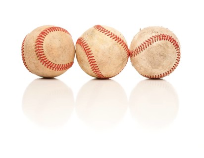 Three Baseballs Isolated on a Reflective White Background