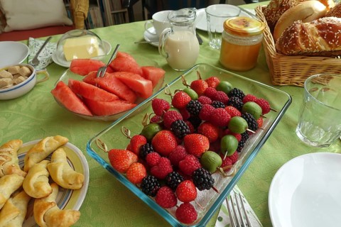 Berry skewers, strawberries, blackberries, raspberries, gooseberries, watermelon, slices, milk jug,