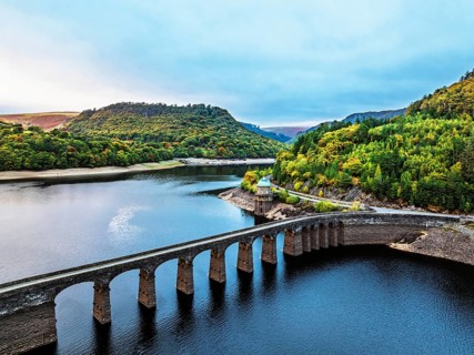 Autumn over Garreg Ddu Dam from a drone, Elan Valley, Caban-Coch Reservoir, Rhayader, Wales, UK