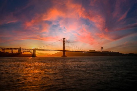 Gorgeous orange sunset with pink clouds over the Golden Gate in San Francisco, California. United