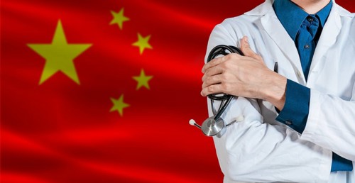 Doctor with stethoscope on China flag. Doctor holding stethoscope on China flag