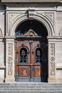 Magnificent wooden door from Alexander von Humboldt Gymnasium with artistic carvings and decorative