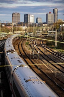 Train on the tracks west of Essen central station, skyline of the city centre, ICE train, North