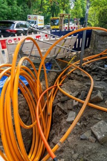 Laying of fibre optic cables, empty conduits are laid under a pavement, in which the actual fibre