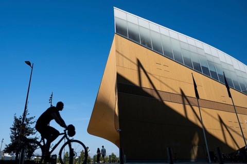 Cyclist, Oodi Central Library and Cultural Centre, design by ALA Architects, Helsinki, Finland