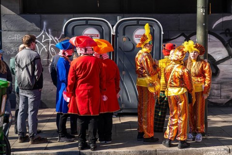 Rose Monday carnival parade in Düsseldorf, dressed up fools were in front of mobile toilets