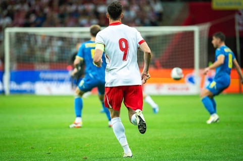 Soccer player capitan with number 9 on his back during the match