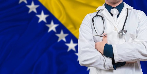 Male doctor with stethoscope on Bosnia flag. Doctor holding stethoscope on Bosnia flag
