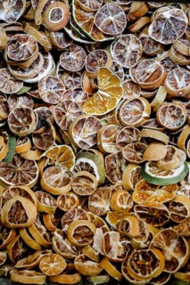 A collection of dried citrus slices featuring lemons and limes. Ideal for natural decoration,