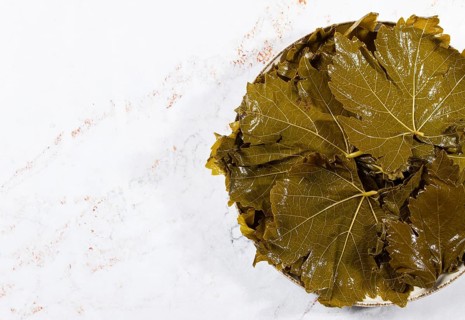 Canned grape leaves, for cooking dolma, on a plate