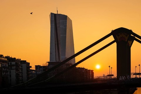 The sun rises behind the European Central Bank (ECB) in Frankfurt am Main, Frankfurt am Main,