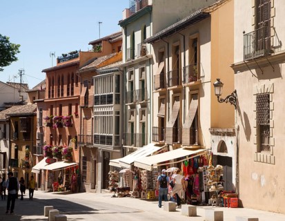 Historic buildings architecture in Cuesta de Gomerez street, Granada, Spain