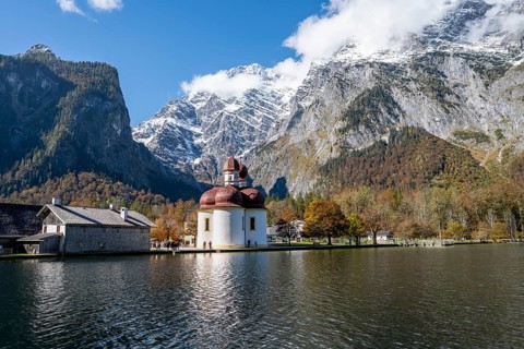 Königssee with Watzmann massif and pilgrimage church St. Bartholomä, autumnal mountain landscape,