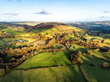 Farms over Trecastle from a drone at sunset, Brecon Beacons National Park, Powys, Wales, England,