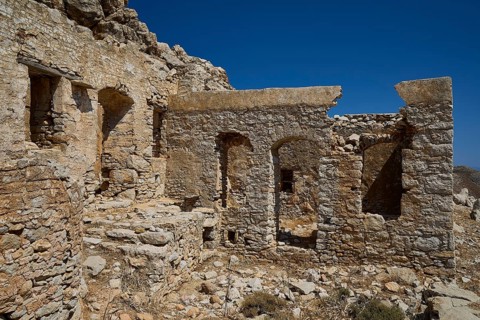 Weathered ancient stone ruins with blue sky in the background, historic atmosphere, lost place,