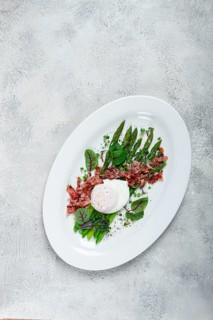 Asparagus with poached egg and fried bacon, micro greens and spices, breakfast, homemade, no people