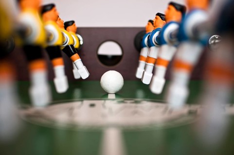 Football table players and balll close up