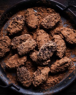 Chocolate treats, coated in a generous layer of rich cocoa powder. These homemade confections offer