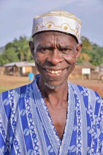 Portrait of a smiling man in Muslim dress, Muslim, Waiima, Kono District, Sierra Leone