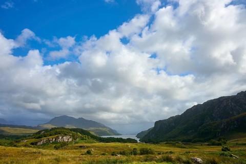 Sunny meadow landscape with mountains and a sky full of clouds, Loch Maree, Taagan, Achnasheen,