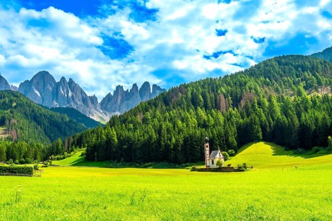 Scenic summer landscape featuring st. Magdalena church in the idyllic val di funes, with the