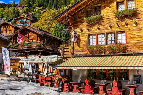 Flower-decorated inn, Grimentz, Val d'Anniviers, Valais Alps, Canton Valais, Switzerland