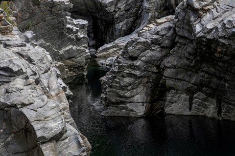 Rocks, granite rock formations in the Maggia River near Ponte Brolla, in the Maggia Valley, Valle