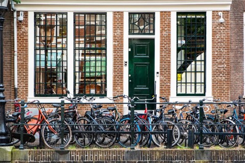 Bicycles parked on a canal in the city centre of Utrecht, Netherlands