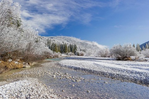 Isar valley in winter at temperatures of minus 18 degrees Celsius. Snow covered landscape with the