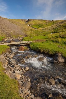 Flowing water below the waterfall. Hengifoss waterfall is located in Hengifossá in