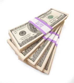Ten thousand dollars in stacks of one hundred dollar bills isolated on white