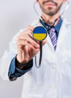 Ukraine health and medical insurance concept. Ukraine Healthcare System, doctor holding stethoscope