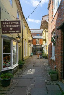 Specialist shops in Old Hughenden Yard alleyway, Marlborough, Wiltshire, England, UK