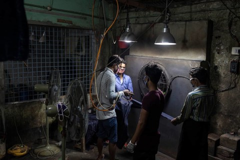 Worker in a denim dyeing factory, textile industry, Dhaka, Bangladesh