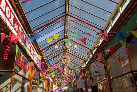 Decorations and bunting flags in Victoria Arcade c 1920s, Great Yarmouth, Norfolk, England, UK