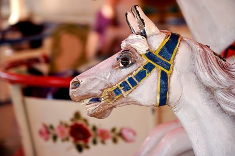 Painted wooden horse in an old children's carousel, historic Wies'n, Oide Wiesn, Oktoberfest,
