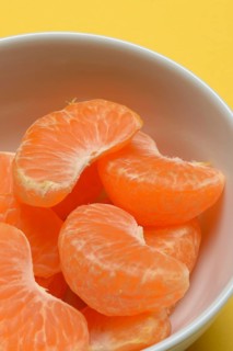 Clementine pieces in peel, citrus fruit