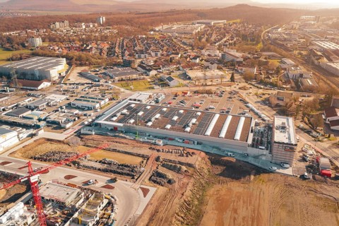 Industrial area with photovoltaics and construction in an urban autumn landscape, PV construction