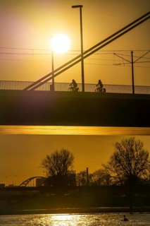 Cyclist on the Oberkassler Rhine Bridge, Düsseldorf, North Rhine-Westphalia, Germany