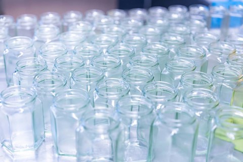 Large number of empty jars, properly arranged on a table, jam production, Haselstaller Hof,