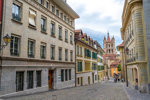 Alley in the Cité and tower of Notre Dame de Lausanne Cathedral, historic old town, Lausanne, Vaud,