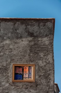 Clay plaster wall with colourful window, house, facade, house wall, plaster wall, architecture,