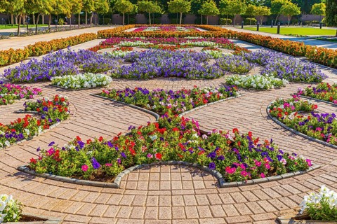 Park decorated with flowers in front of the Sultan Qaboos Mosque, Muscat, Arabian Peninsula,