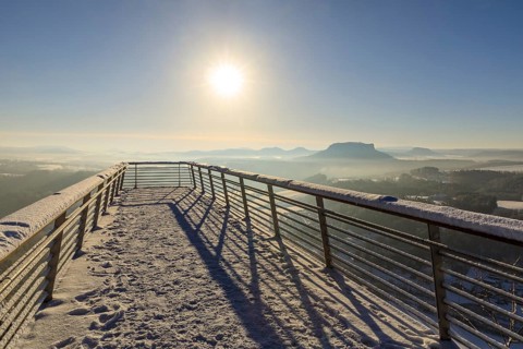 Floating viewing platform of the Basteiaussicht on a winter morning, light fog lies over the Elbe