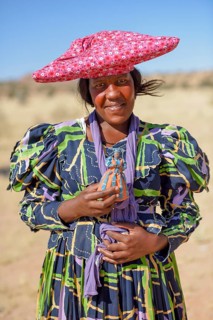 Herero woman in traditional costume, near Khorixas, Kunene Region, Namibia