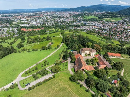 Aerial view of castle Jesuitenschloss Merzhause and city Freiburg, Germany