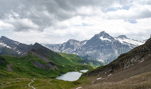 Mountain landscape with Bachalpsee mountain lake, Mittelhorn summit in the back, Bernese Alps,