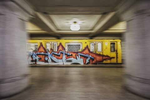A graffiti-covered underground train enters the Rüdesheimer Platz underground station in Berlin, 27